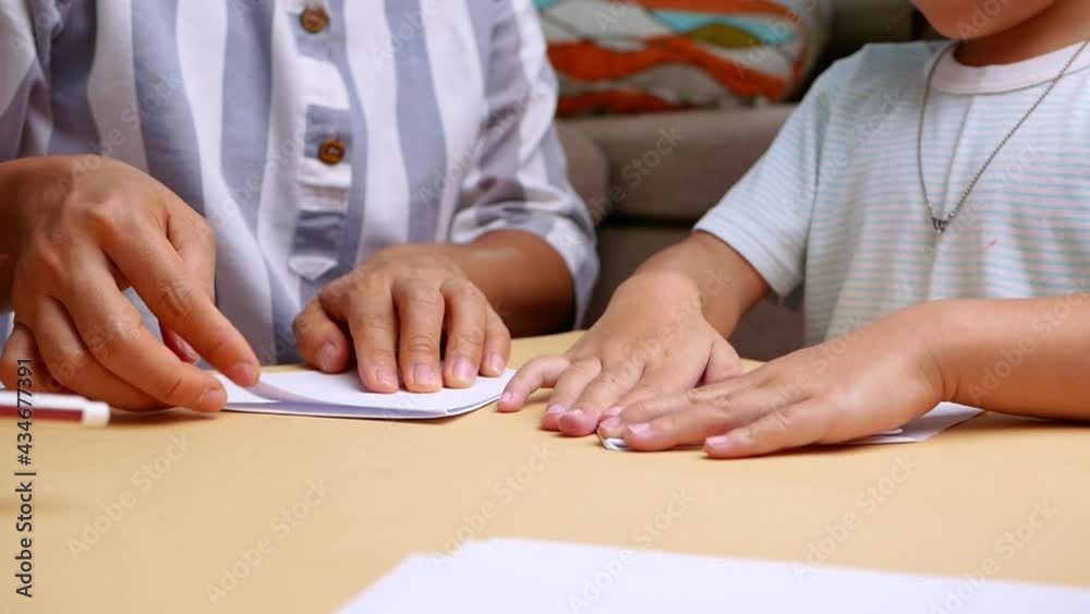 Close up of Mother and daughter learning about The Japanese art of