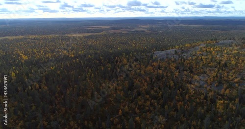 Scenery Of Forest Mountains With Colorful Trees At Pyha-Luosto National Park In Lapland, Finland. - Aerial Shot photo