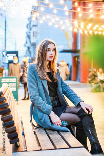 woman sitting on a bench in the city steadicam shot