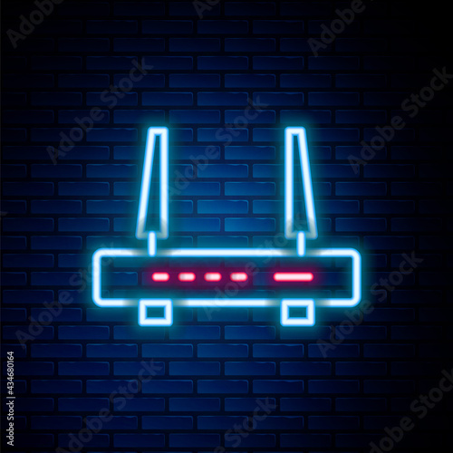 Glowing neon line Router and wi-fi signal icon isolated on brick wall background. Wireless ethernet modem router. Computer technology internet. Colorful outline concept. Vector