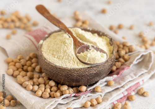 Bowl of raw chickpea flour and beans photo