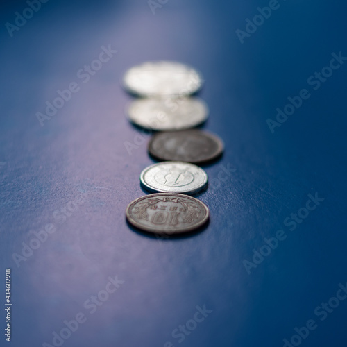Chinese and Japanese coins. Coin collection. Coins on a blue background.