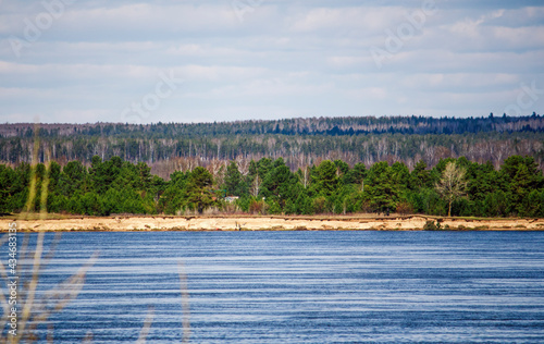 the Volga River and the village on the other side in the forest