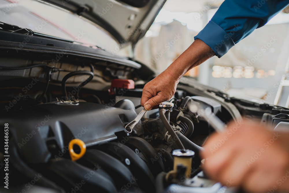 Hand of Auto Mechanic Man With a Wrench. Engineer and Car Repair concepts