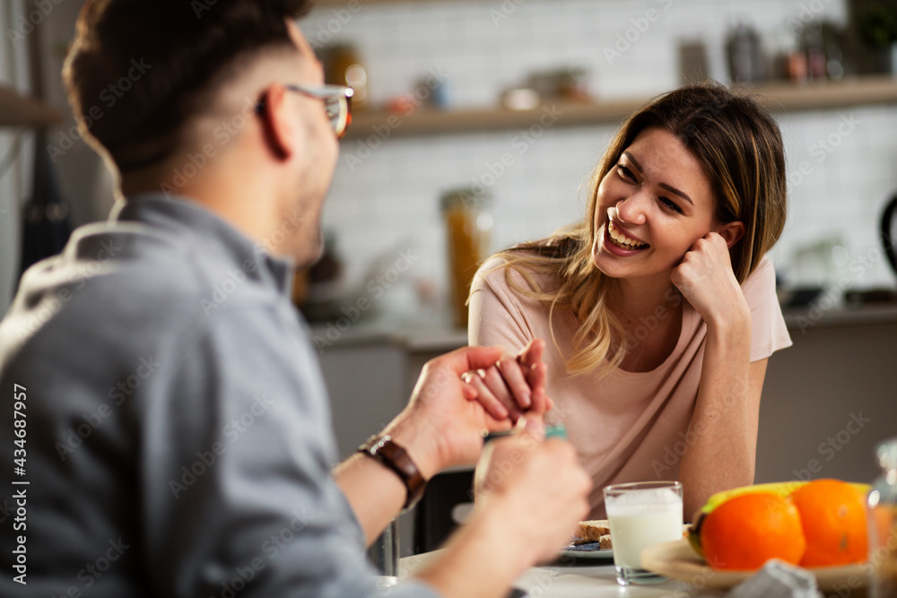 Beautiful young woman enjoying in breakfast with her husband. Husband and wife enjoying in the morning.