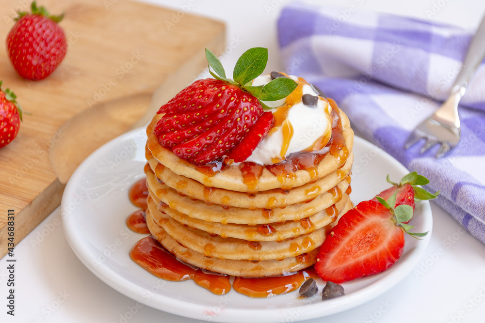 Home made Fresh Pancake with Honey and Strawberry Syrup and Strawberry topping
Home made Fresh Pancake with Honey and Strawberry Syrup and Strawberry topping