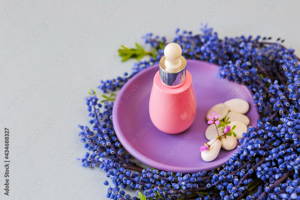 Face serums in pink glass container. Cream, natural spa cosmetics. copy space Face serums in pink glass container. Cream, natural spa cosmetics. copy space