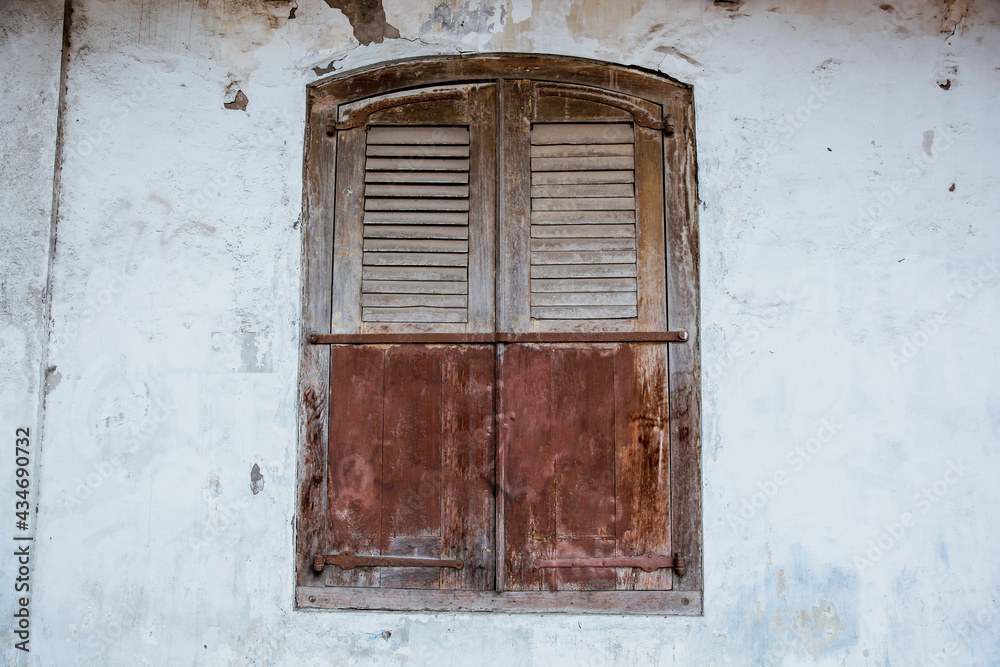 Old wooden windows on white wall