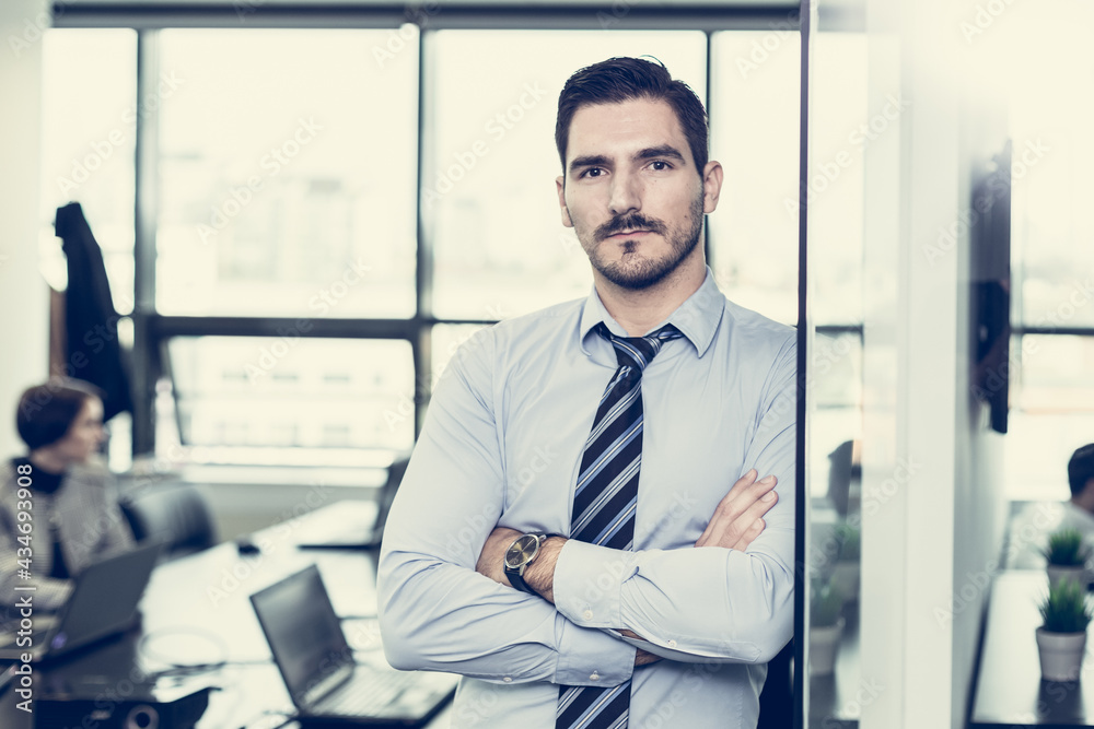 Team leader with coworkers working in office. Team leader with coworkers working in office.
