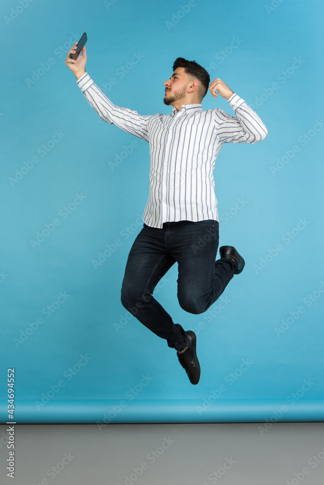 Young man's portrait on blue studio background. Concept of human emotions, facial expression, youth, sales, ad. Young man's portrait on blue studio background. Concept of human emotions, facial expression, youth, sales, ad.