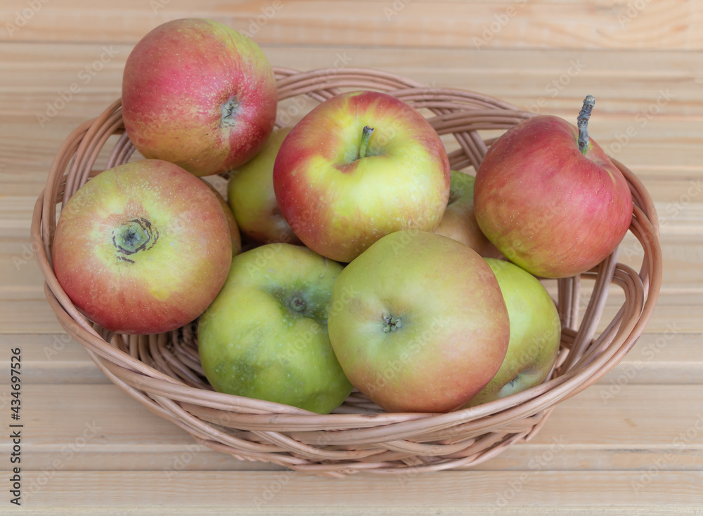 Fresh apples in a basket. Benefits of apple fruits concept Fresh apples in a basket. Benefits of apple fruits concept
