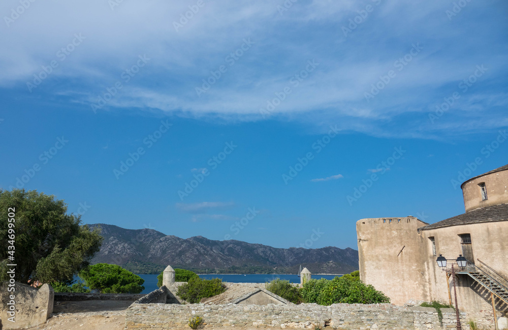Old genoese citadel in Saint-Florent with wonderful view of the mediterranean mountains. Corsica Island, France.
