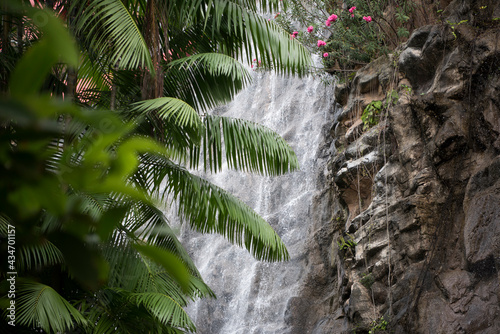 Waterfall from the rock with the sign of Sentosa