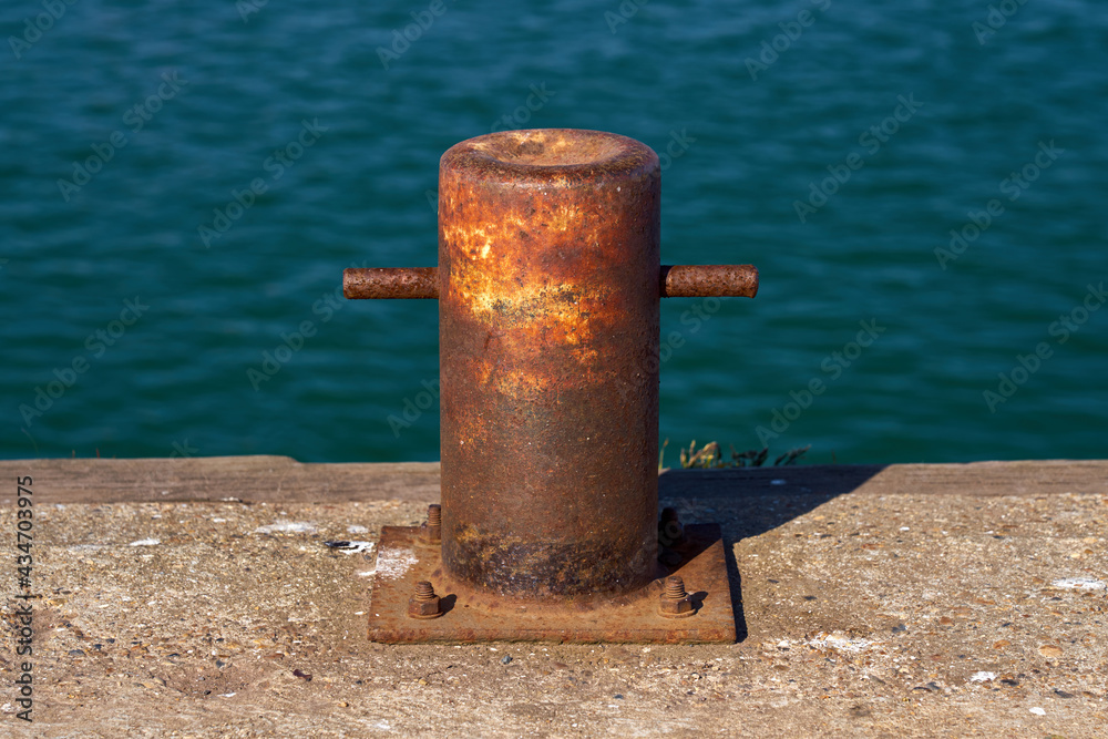 A samson post style single bitt mooring bollard for boats