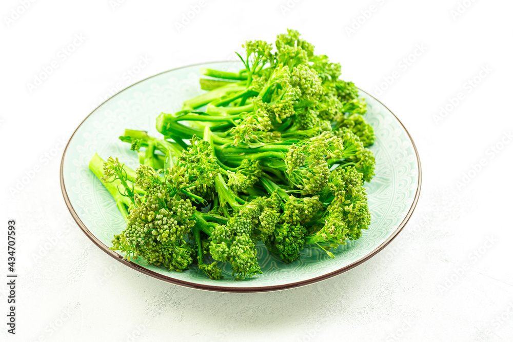 Organic Broccolini (bimi) in bowl on white background Organic Broccolini (bimi) in bowl on white background