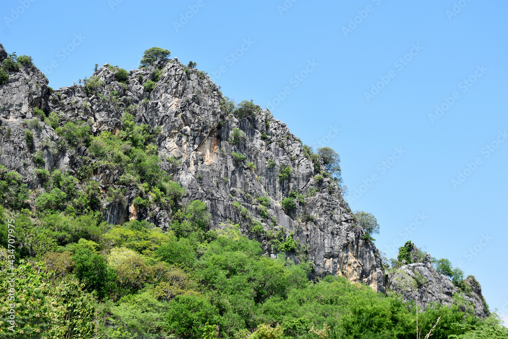 Limestone mountains on white background