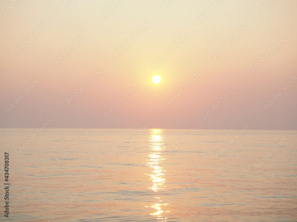 Soft focus blurred nature of beautiful sunset at sea for background