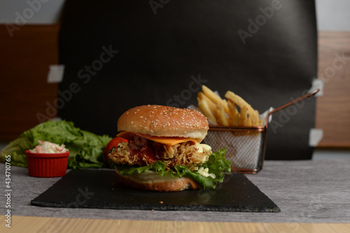 Fastfood Chicen, Beaf Zinger Burger with fries Black background  photo