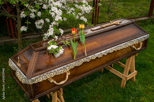 Burial coffins on a background of green grass.