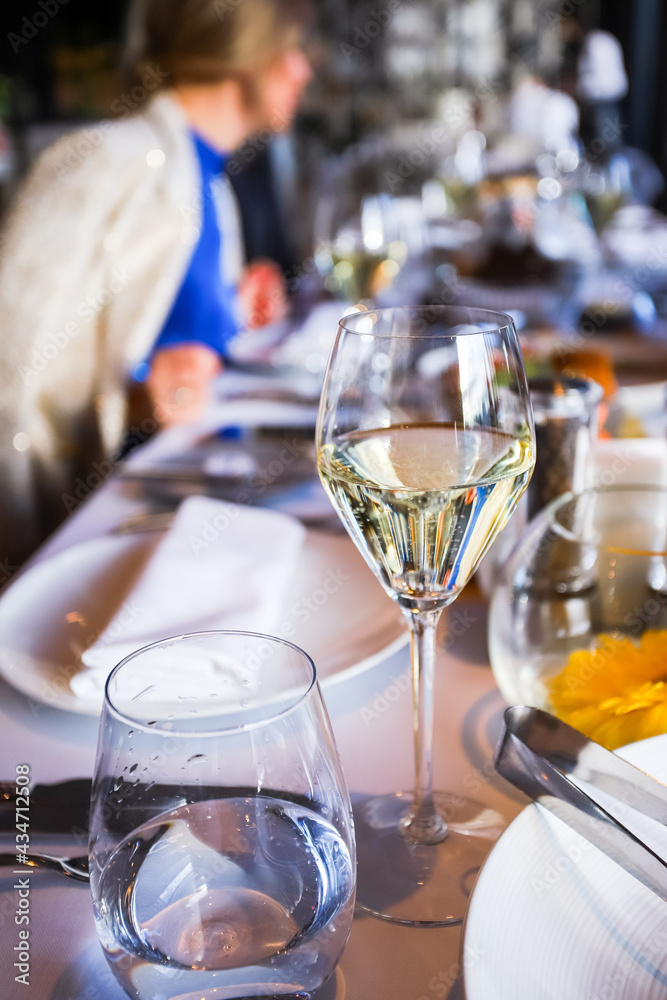 Glassware, glasses for white wine on a table in the restaurant. Banquet, cutlery, table setting. Glassware, glasses for white wine on a table in the restaurant. Banquet, cutlery, table setting.