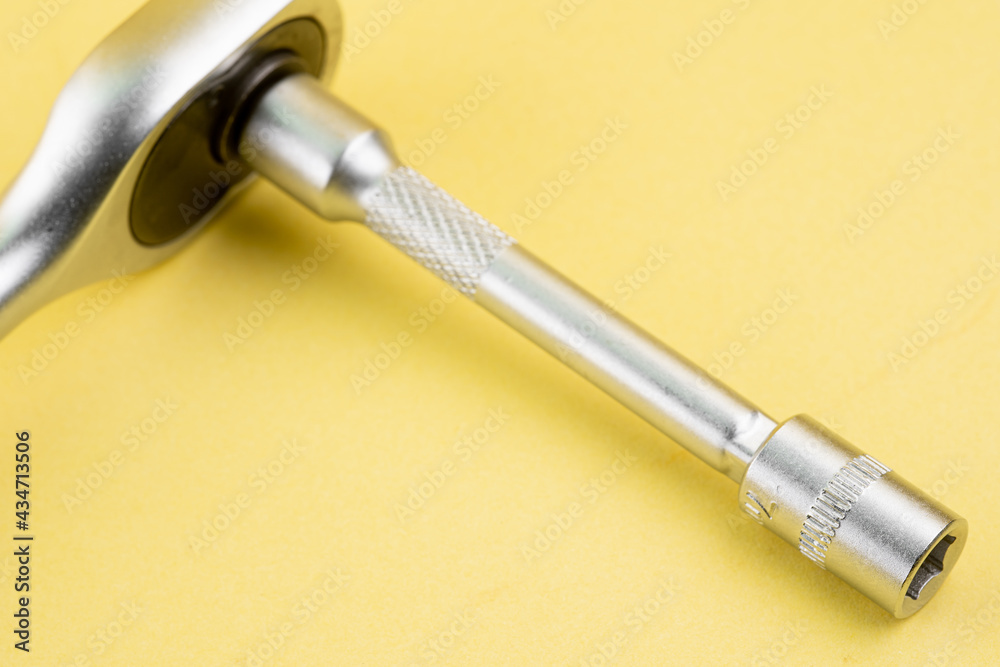 Naklejka premium Ratchet with extended socket and bit adapter