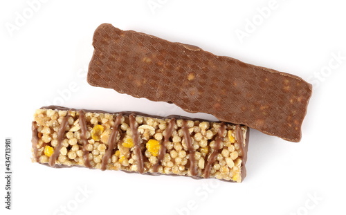 Two chocolate covered granola bars, muesli snack isolated on white background, top view