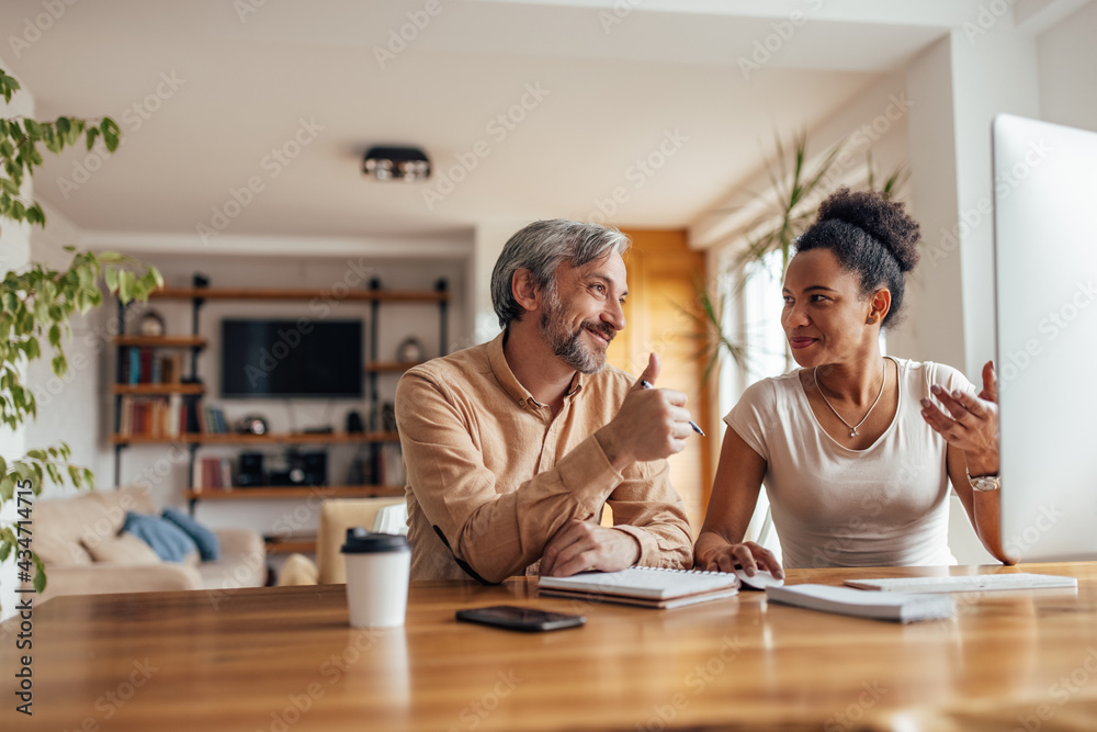 African woman and her business colleague, working together at home office. African woman and her business colleague, working together at home office.