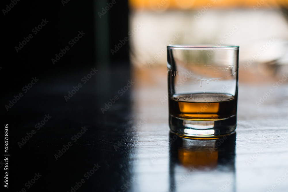 Whisky glass on a wooden surface Whisky glass on a wooden surface