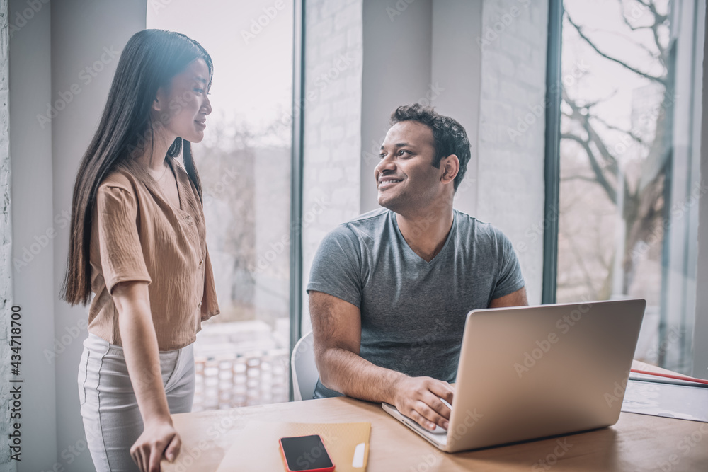 Colleagues working in the office and looking involved