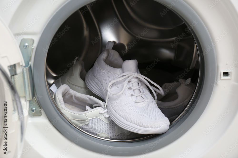 Clean sports shoes in washing machine drum Clean sports shoes in washing machine drum
