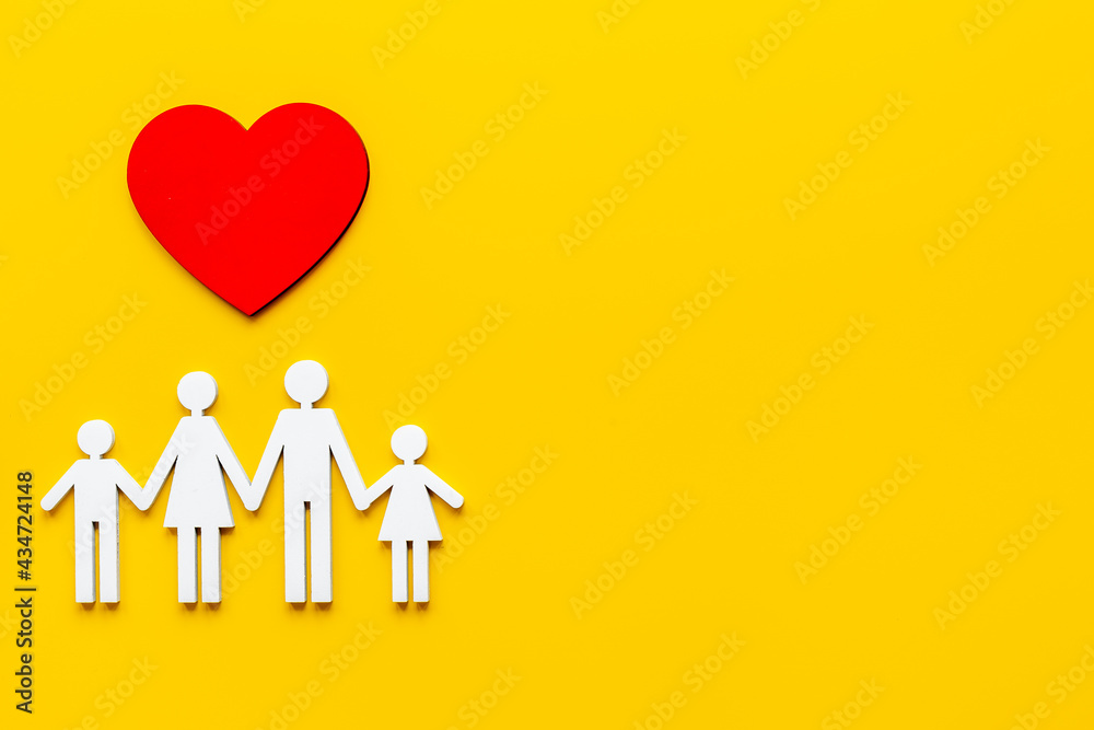Family wooden figure and heart shape. Life insurance concept Family wooden figure and heart shape. Life insurance concept