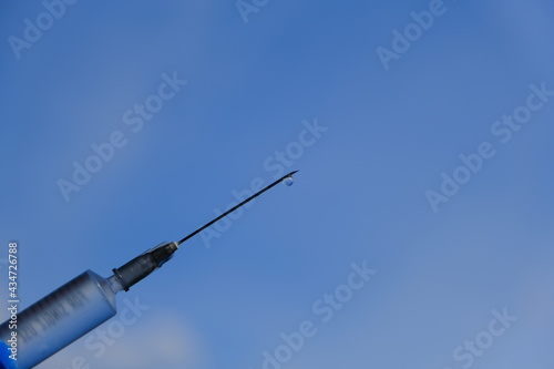 syringe on blue