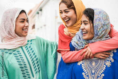 Young muslim women having fun outdoor - Main focus on center woman face