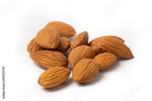 Close-up of almonds on a white background.