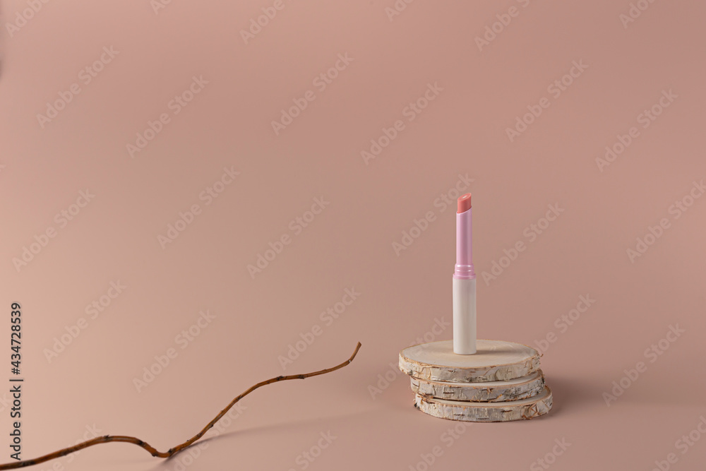 Delicate matte lipstick on a solid background. The concept of eco Delicate matte lipstick on a solid background. The concept of eco