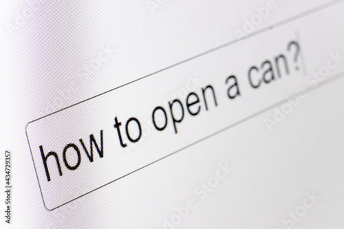 Search bar on a computer monitor with the question How to open a can. Searching for information on the Internet, close up.