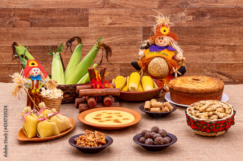 Brazilian june party. Typical foods of the June festival. hominy, boiled corn, corn cake, popcorn, broccoli, paçoca, genipapo and peanuts. It is written: Viva Sao Joao in Portuguese photo