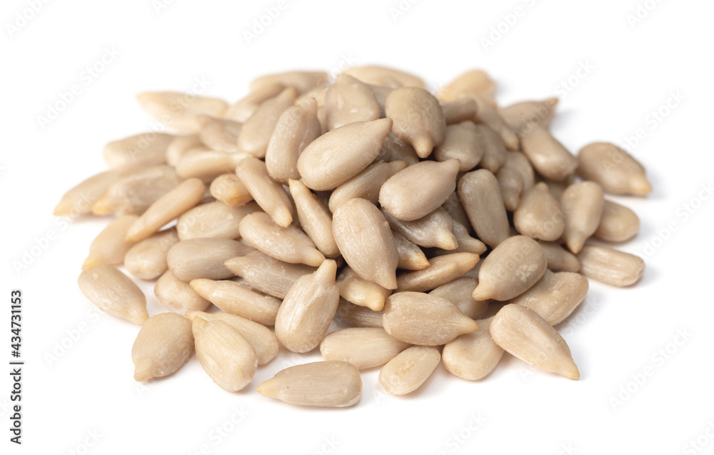 pile of peeled sunflower seeds isolated on white background