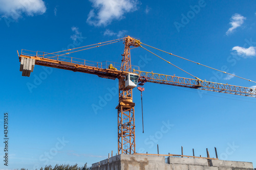 Construction crane in a blue sky