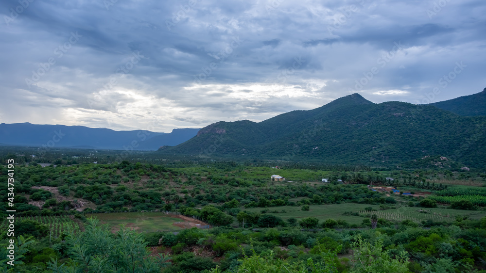 Naklejka premium Amazing view of mountains and clouds in the spring at sathyamangalam, India.