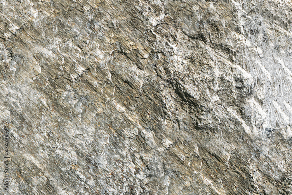 Stone texture abstract background. Detail of natural material gray granite old rock wall
