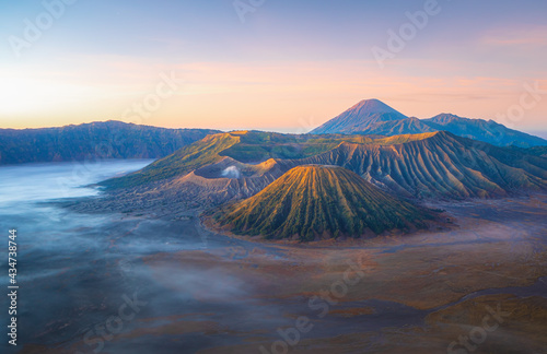 Mt.Semeru Mt.Bromo Mt.Batok , when the sunrise is lightly fog and the sky is beautiful. Smoke rising from the crater. , Indonesia Tengger Semeru national park.