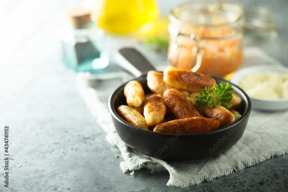 Traditional German potato dumplings served with parsley Traditional German potato dumplings served with parsley