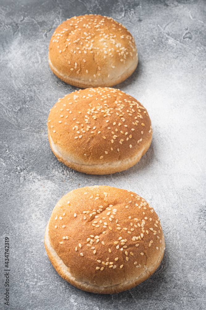 Burger round buns for making fast food sandwiches, on gray background