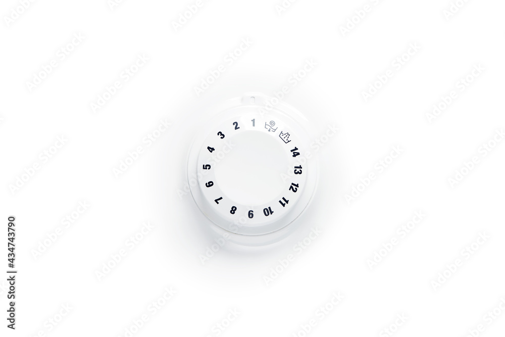 Close up view of washing machine cycle program mode switch handle selector knob wheel with digits around and two icons (spin and drain) isolated on the bright solid fond plain clean white background Close up view of washing machine cycle program mode switch handle selector knob wheel with digits around and two icons (spin and drain) isolated on the bright solid fond plain clean white background
