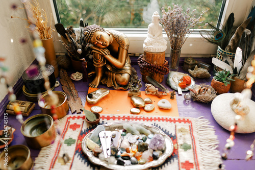 Buddha's home altar with stones and offerings photo