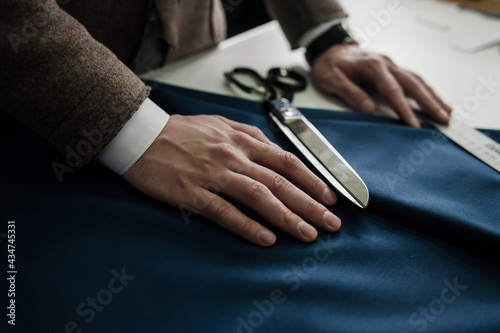 tailor s hands on the fabric