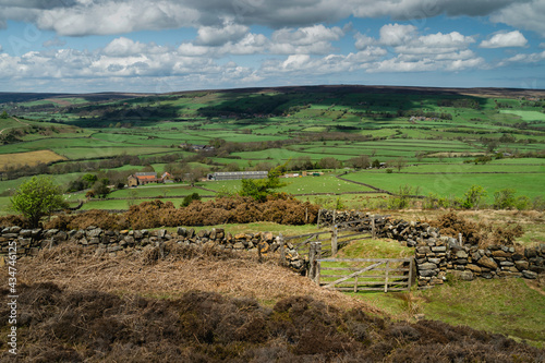 Wooden gates and public footpath through the North York Moors and valley at Fryup, UK. photo