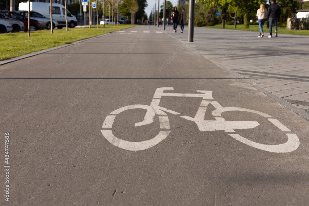 Obraz premium Bicycle Lanes in Park. White sign bike path.