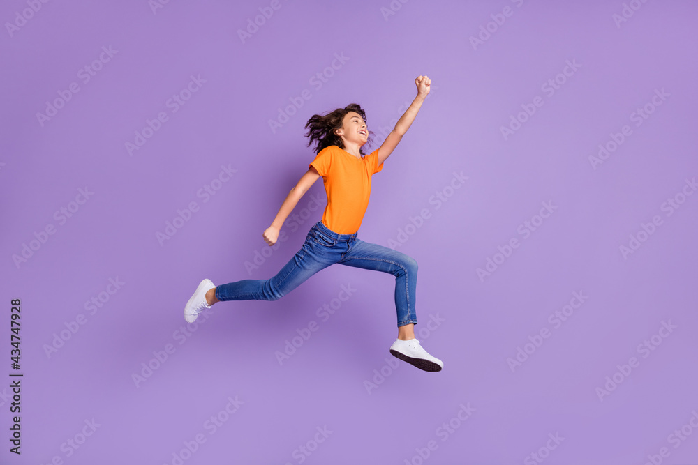 Full length body size view of attractive successful cheerful boy jumping striving isolated over violet purple color background